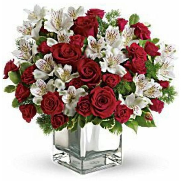 A beautiful centerpiece of 20 Red Roses & 10 White Alstroemeria in a Square Glass Vase