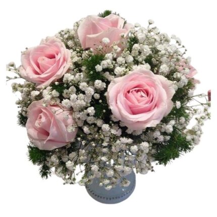 A centerpiece featuring 10 soft baby pink roses beautifully complemented by airy white gypsophila.