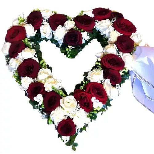 Pure Love Cluster Dubai – vibrant red and white rose heart arrangement for birthdays and anniversaries.